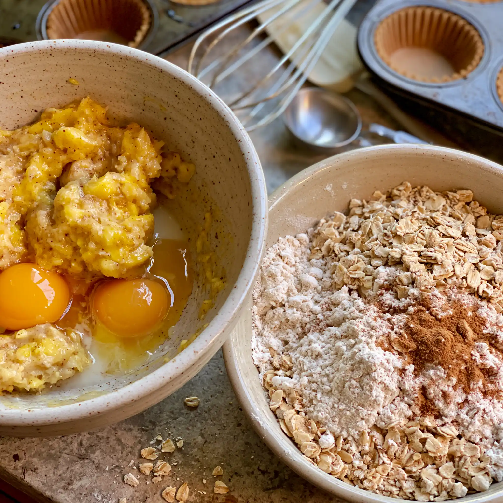 Banana Oatmeal Muffin batter being prepared with mashed bananas and rolled oats